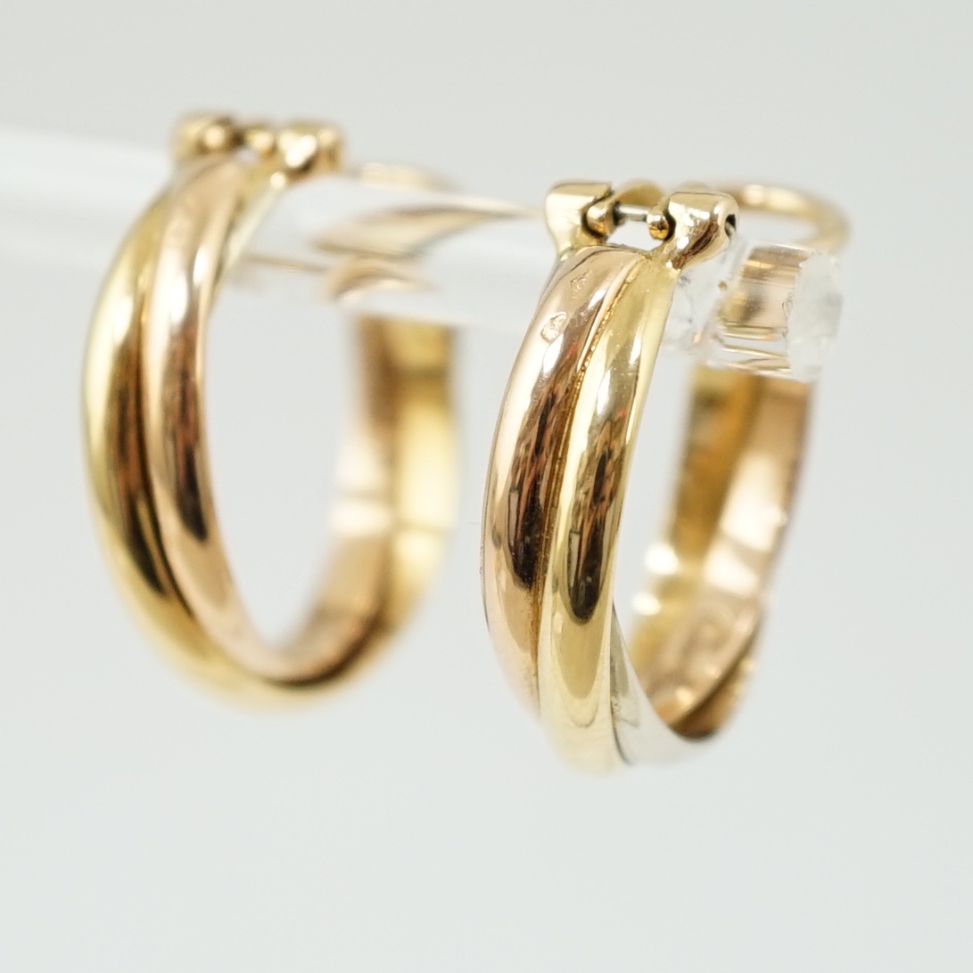 A pair of French Cartier three colour 18ct gold interwoven hoop ear clips